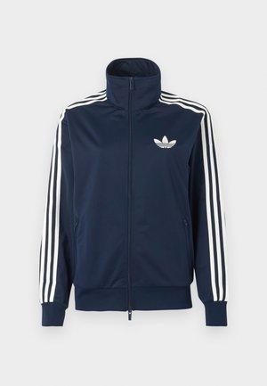 Αθλητικό μπουφάν με φερμουάρ σε ναυτικό μπλε χρώμα, με λευκές τρεις ρίγες στα μανίκια και λευκό λογότυπο τριφύλλι αριστερά στο στήθος.