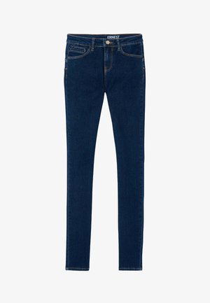 Jeans en denim bleu foncé au design ajusté, dotés de cinq poches et de coutures dorées contrastantes le long des coutures. Texture lisse, taille mi-haute.