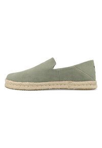 Green suede slip-on espadrille with braided jute sole, low heel, and minimalist design, shown in side profile on white background.