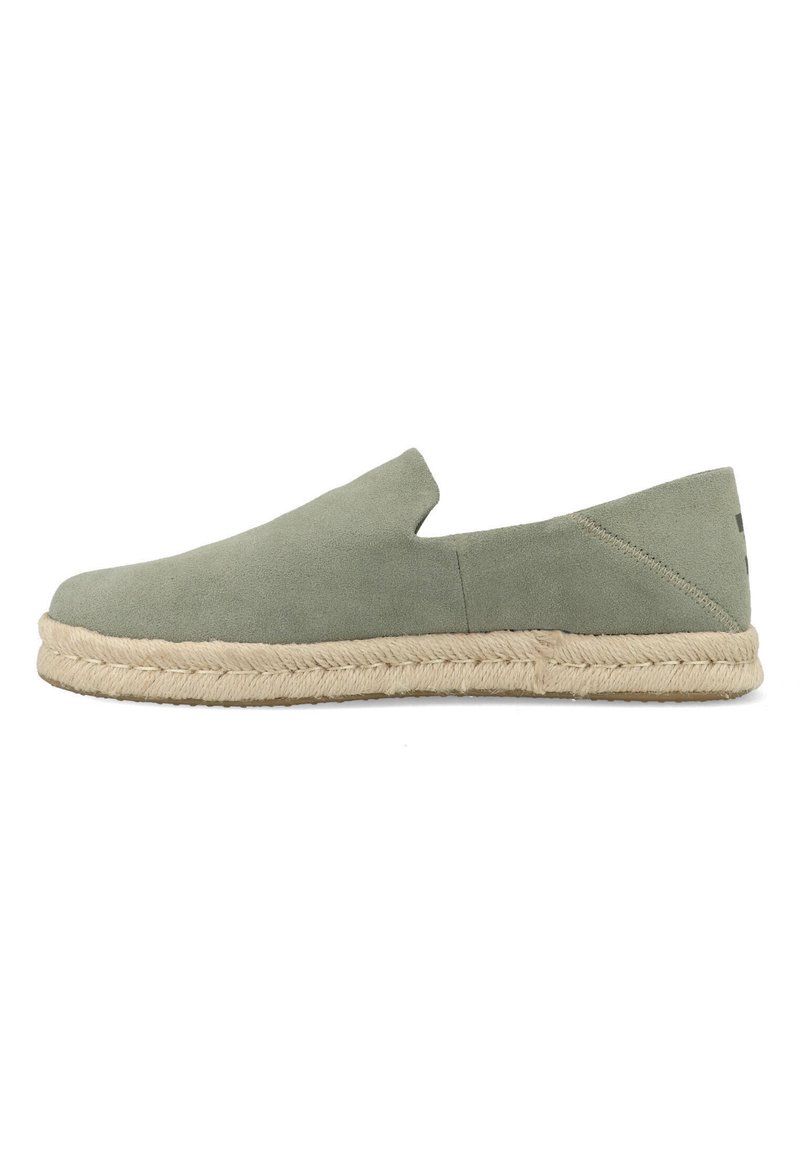Green suede slip-on espadrille with braided jute sole, low heel, and minimalist design, shown in side profile on white background.