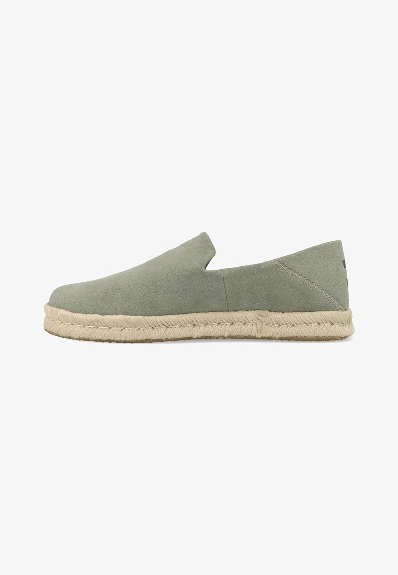 Green suede slip-on espadrille with braided jute sole, low heel, and minimalist design, shown in side profile on white background.