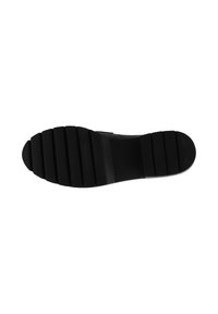 Black rubber shoe sole with horizontal grooves, slightly curved in shape, featuring a textured surface for traction and durability.