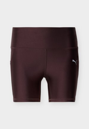 Σκούρα καφέ αθλητική ποδηλατική βερμούδα με ψηλή μέση, επίπεδες ραφές και μικρό αντανακλαστικό λογότυπο Puma στο αριστερό μηρό.