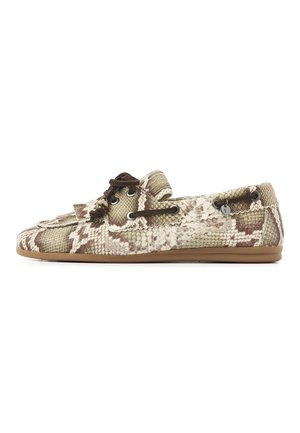 Light brown and cream snakeskin-patterned moccasin with brown lace details and a flat tan sole, shown from the side.