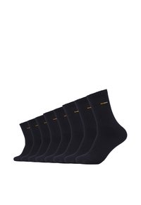 Neuf paires de chaussettes côtelées bleu marine foncé en tissu doux, avec un petit logo orange près du haut de chaque chaussette.