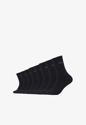 Neuf paires de chaussettes côtelées bleu marine foncé en tissu doux, avec un petit logo orange près du haut de chaque chaussette.