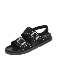 Las sandalias de ante negras cuentan con dos correas anchas con acentos de tachuelas plateadas y hebillas, una correa trasera para el tobillo y una suela texturizada negra.