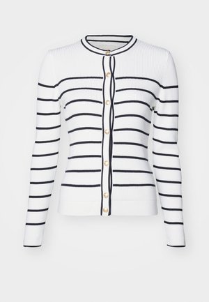 Bílý žebrovaný kardigan s námořnickými horizontálními pruhy, s kulatým výstřihem, dlouhými rukávy a zlatými knoflíky na přední straně.