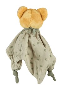 Plush bear with fluffy yellow head and orange ears attached to a beige, polka dot patterned blanket. Connected with a green tied strap.