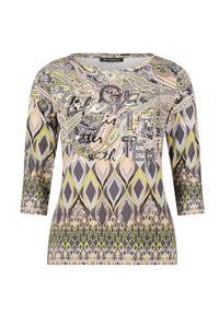 Patterned long-sleeve shirt in beige, green, and gray. Features a round neckline and decorative text. Made from soft, stretchy fabric.