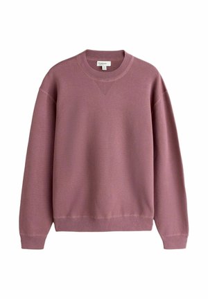 Pink, long-sleeve sweatshirt made from soft material with a ribbed neckline and cuffs. Features a subtle v-shaped knit detail on the front.