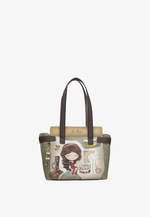Borsa con manici marrone scuro con una ragazza dei cartoni animati con gli occhi chiusi, seduta, e la scritta "Conosci te stesso" su uno sfondo beige e verde.