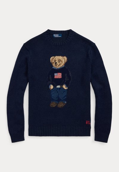 Navy sweater with knitted teddy bear wearing jeans and a sweater with an American flag, ribbed cuffs, and "RL" initials on hem.