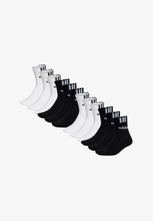 Tolv par svarta och vita Adidas-strumpor i medellängd, ordnade i växlande färger med logotyp och tre ränder på muddarna.