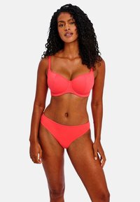 Coral bikini set featuring a structured underwire bra with adjustable straps and matching low-rise bikini briefs, both in a smooth finish.