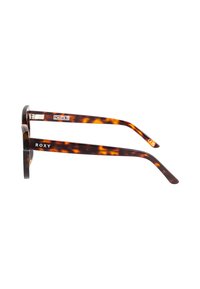 Gafas de sol carey con gruesos montajes cuadrados. Material de acetato, con detalles metálicos y el nombre de la marca "ROXY" en la patilla.