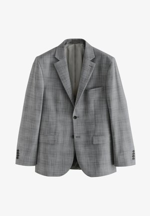 Traje de cuadros gris con un corte a medida, que incluye una americana de un solo botón, pantalones a juego, camisa blanca y una corbata estampada. Zapatos de vestir negros.