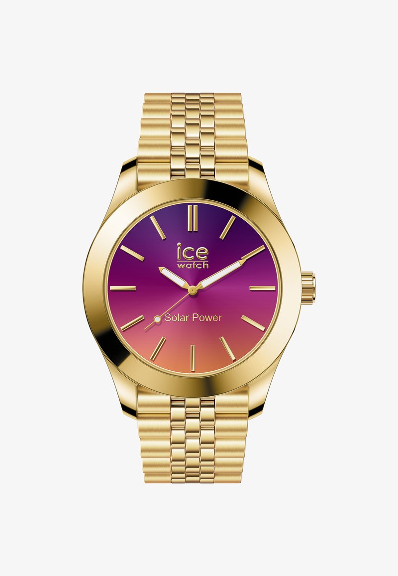 Złoty zegarek solarny z gradientową tarczą w odcieniach fioletu i pomarańczu, minimalistycznymi znacznikami godzinowymi oraz złotą metalową bransoletą o plecionym wzorze.