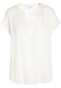 Krämfärgad kortärmad blus med rund krage, V-ringning och subtila rynkor vid halsringningen, tillverkad av lättviktsmaterial.