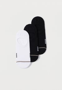 Tri páry členkových ponožiek: jeden biely, dva čierne. Každý pár má tenký zlatý prúžok a elastickú pásku pre bezpečné uchytenie. Mäkký materiál.