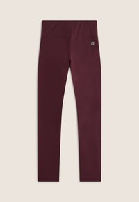 Leggings bordeaux realizzati in tessuto elastico, design a vita alta, texture liscia e un piccolo patch con logo sulla cintura.