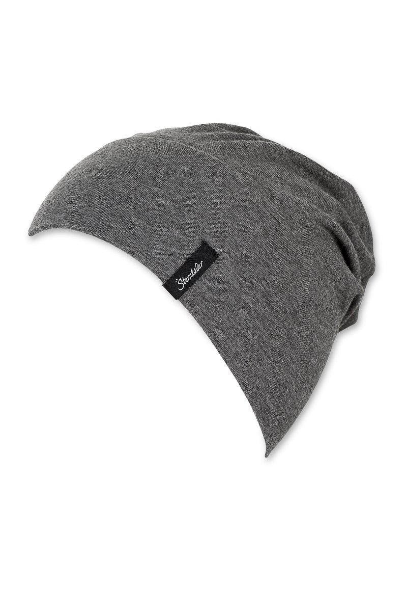 Gray slouch beanie made of soft, textured fabric with a slightly tapered shape and a small black label showing the brand name.