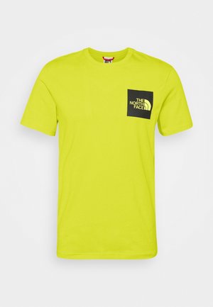 Jasnożółty T-shirt z krótkim rękawem z czarną naszywką w kształcie kwadratu na lewej piersi z napisem "The North Face".