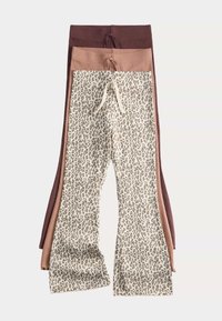 Tři páry legín: dva jednobarevné (hnědé a světle béžové) a jeden vzorovaný s béžovým a hnědým leopardím potiskem; obsahuje šňůrky.