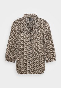 Camicia a pulsante floreale con una base verde scuro. Presenta motivi floreali rosa chiaro e bianchi, maniche a sbuffo corte e un colletto.