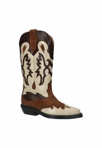 Braune und cremefarbene Cowboy-Stiefel mit dekorativer Stickerei, spitz zulaufender Spitze und gestapeltem Absatz; mit Blitzen und vogelartigen Lederakzenten versehen.