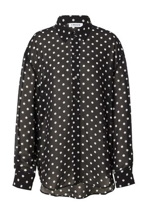 Schwarze transparente Bluse mit weißen, runden Punkten, klassischem Kragen und langen Ärmel mit geknöpften Manschetten.