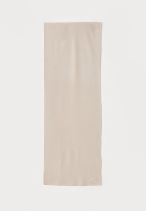 Beige sjaal gemaakt van zacht stof, met een gladde textuur en een rechthoekige vorm. Heeft een discreet logo in de onderhoek.