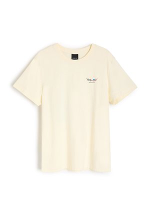 Jasnożółta bawełniana koszulka z krótkim rękawem i okrągłym dekoltem. Posiada mały nadruk na piersi. Miękka faktura, minimalistyczny styl.