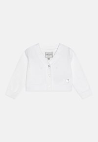 Balta adīta jakas ar garām piedurknēm, V-veida kakla izgriezumu, sešām sirds formas pogām un mazu sirds logotipa aplikāciju kreisajā pusē.