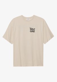 Nyomott mintás póló - beige