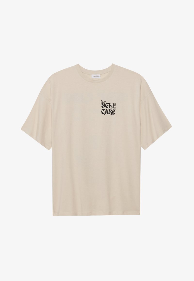 Beżowa bawełniana koszulka z krótkim rękawem, okrągłym dekoltem i czarnym nadrukiem graficznym z napisem "SELF CARE" oraz wzorem motyla.