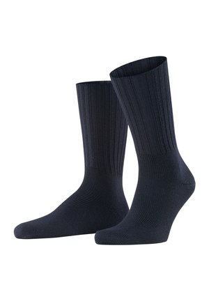 Dunkelnavyfarbene Socken mit einem gerippten Muster, mittellange Länge bis zur Wade und verstärkten Zehen- und Fersenbereichen für Langlebigkeit. Glatte Oberfläche, elastischer Stoff.