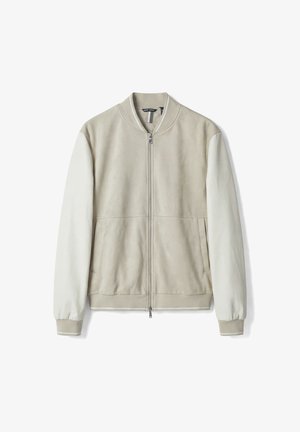 Beige bomberjack met geribbelde kraag en manchetten, licht crèmekleurige lange mouwen, ritssluiting aan de voorkant en zijzakken.