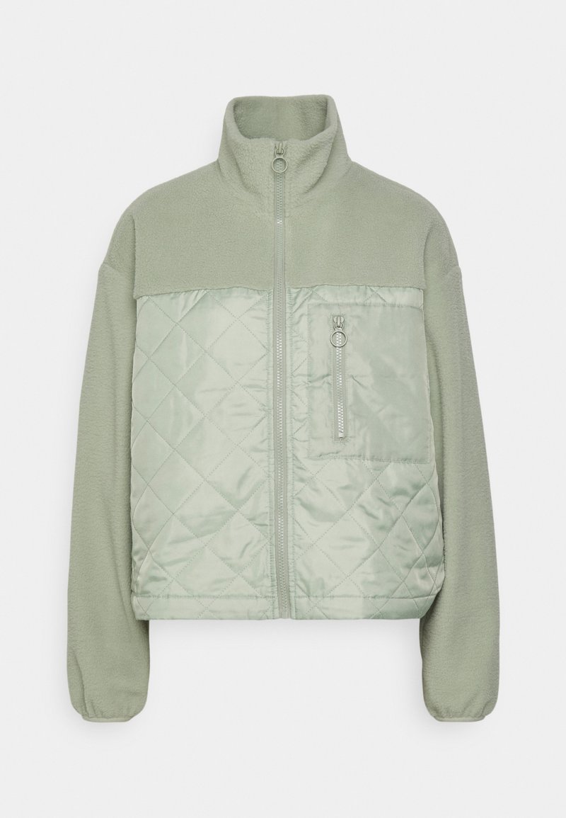 Veste polaire vert clair avec panneau avant matelassé, col montant, fermeture éclair intégrale et poche poitrine zippée.