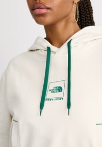 The North Face COORDINATES CROP HOODIE - Športni pulover - white dune
