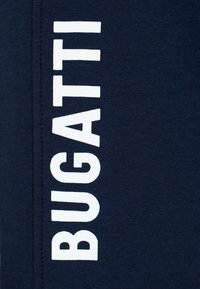 Navy blue fabric with white "BUGATTI" text printed vertically. Smooth texture, no additional patterns or hardware visible.
