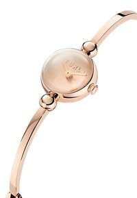 Orologio rosa oro con un quadrante rotondo e traslucido, caratterizzato da un design del quadrante minimalista e un bracciale sottile e curvo. Accenti sferici notevoli sui lati.