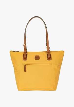 Gele draagtas met bruine leren handgrepen, voorvak met rits en een klein gebrandmerkt leren patch onder de rits.