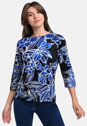 Black top featuring a floral pattern in shades of blue and white, with three-quarter sleeves and a round neckline.