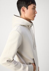 BOSS SAGGY - Majica s kapuljačom i patentnim zatvaračem - light beige