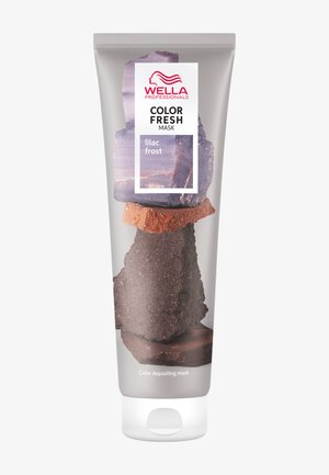 Farveafgivende maske i en tube med et transparent design. Etiketten viser "Wella Professionals" og "lilla frost." Sten er illustreret på emballagen.