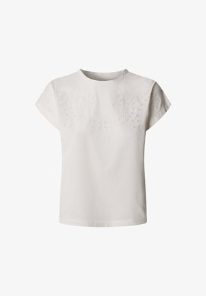 Witte blouse met korte mouwen, ronde hals en subtiele bloemrijke borduursels over de borst en schouders.