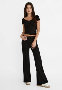 Stradivarius WIDE-WITH FOLD-DOWN WAIST - Kalhoty - black