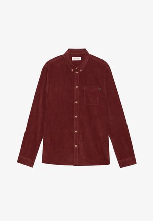 Red corduroy shirt with a button-down collar, long sleeves, front pocket, and gold-tone buttons. Textured fabric.