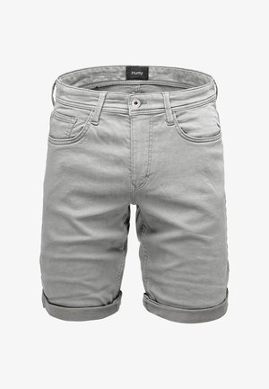 Gray denim shorts with rolled cuffs, five pockets, and a button closure. Features a label "Humy" on the waistband. Smooth texture.